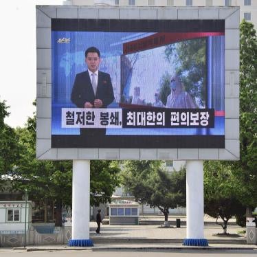 A billboard for North Korean state television in Pyongyang urges citizens to keep up their guard against Covid-19, May 23, 2022.