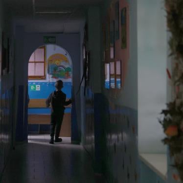 A child walks down a hallway