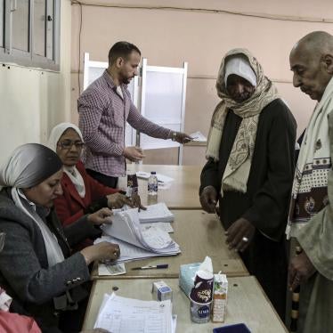 Egyptians cast their ballot at a polling station in Cairo during the presidential election, December 10, 2023.