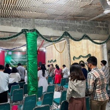 People worship during service inside a church in Jakarta