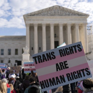 Transgender rights supporters rally outside of the Supreme Court in Washington, DC, US,  December 4, 2024.