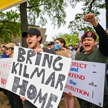 Protestors hold signs saying "Bring Kilmar Home" during a Free Kilmar Abrego and Hands Off protest. 
