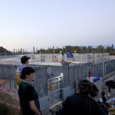 Human rights activists from Italy, Albania and other European countries gather to protest outside the Italian-run migrant detention center in Gjader, Albania, on November 1, 2025.