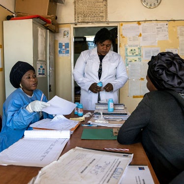 A patient receives a reduced supply of medication for HIV treatment, following the cut of USAID funds for treatment programs in Democratic Republic of Congo, July 31, 2025.