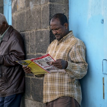 People read newspapers and magazines on a street in Addis Ababa, Ethiopia, November 7, 2020.