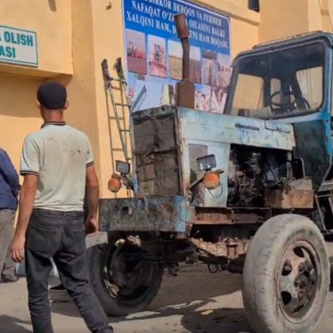 Farmers outside a cotton collection point