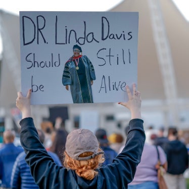 People protest at Forsyth Park after the death of teacher Linda Davis, who was killed in a vehicle collision with a man fleeing from US Immigration and Customs Enforcement (ICE) agents in Savannah, Georgia, US, February 17, 2026. 
