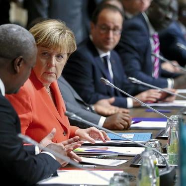 German Chancellor Angela Merkel speaks with Ghana's President John Dramani Mahama during the Valletta Summit on Migration on November 11, 2015.