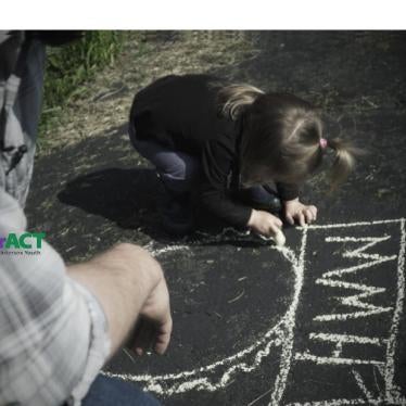 A father plays with his daughter, who was born with atypical sex characteristics. Despite pressure from doctors, the parents chose not to elect medically unnecessary surgeries on their child. 