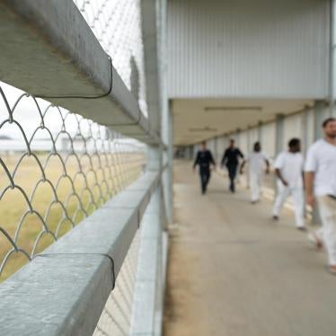 Staff escort prisoners, including Aboriginal and Torres Strait Islander prisoners, through Lotus Glen Correctional Centre. 