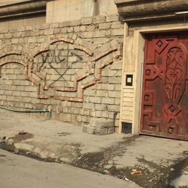 Graffiti that reads "Daesh (ISIS)," marks the home of relatives of an ISIS member in a west Mosul neighborhood, Iraq. © 2018 Private.