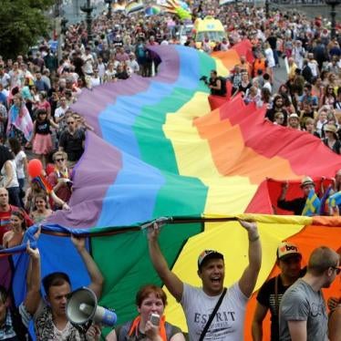 Participants hold a giant rainbow flag during the Prague Pride Parade where thousands marched through the city centre in support of gay rights, in Czech Republic, August 13, 2016. 