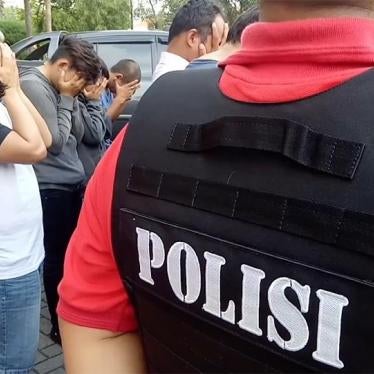 A photo showing members of the LGBT community in Indonesia being rounded up by Police.