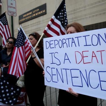 Protesters rally outside the federal court just before a hearing to consider a class-action lawsuit filed on behalf of Iraqi nationals facing deportation, in Detroit, Michigan, US, June 21, 2017. © 2017 Reuters/Rebecca Cook