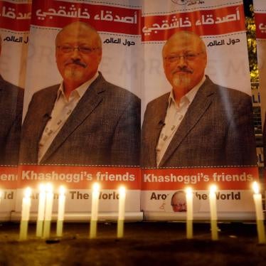 Candles lit by activists protesting the killing of Saudi journalist Jamal Khashoggi are placed outside Saudi Arabia's Consulate in Istanbul. © 2018 Lefteris Pitarakis/AP Photo