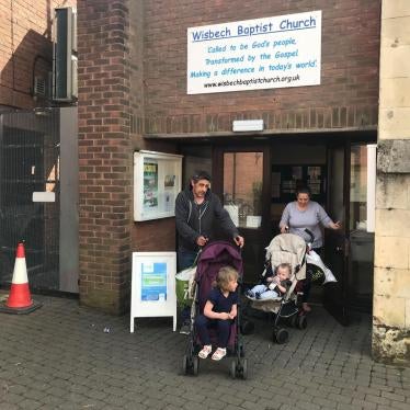 A couple and their two children leave the food bank in Wisbech, Cambridgeshire, after collecting a three day emergency supply of food, April 2019. They told Human Rights Watch the benefit cap left them unable to pay rent and afford food.