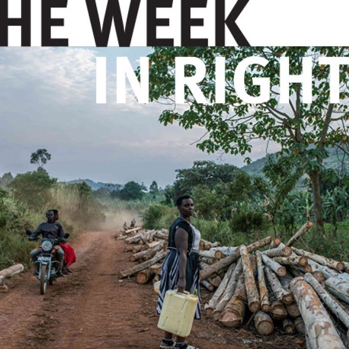 A woman walking home from work in Kijumba, Uganda.